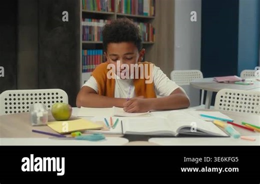 African American little boy kid yawning stretching smiling tired with studying learn writing homework at library child son schoolboy write yawn stretch in school sleepy schoolkid learning schoolwork Stock Video Footage - Alamy