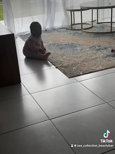 Our baby shark is crawling and he is following his dad isukile 😂😂 don't mind the pink romper yeyokhasa it's from my nephew 😂😂 | According To Makhumalo