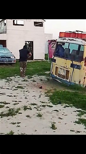 RN1 reusable paint grenade thrown between 2 arguing paintball players