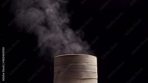 Steamer with traditional Chinese food inside steaming over fire