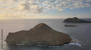 Slow and steady drone footage of Manana Island or Rabbit Island in Hawaii. This has a view of the bird sanctuary as well as the Makapuu Lighthouse in the background. Stock Video