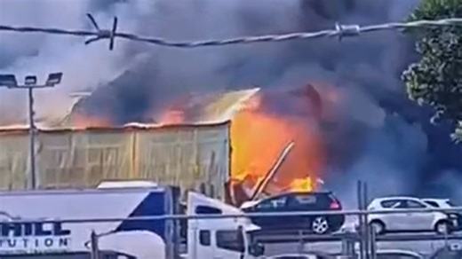 Large fire at South Auckland industrial building sends smoke across sky