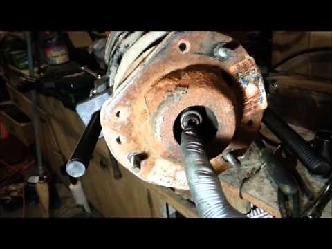 Removing stuck nut from strut rod