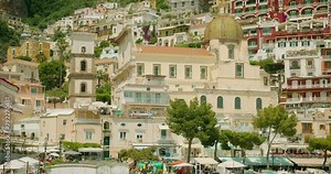 Pastel buildings adorn the Posito town in Italy. Colourful houses stack upon the hillside, offering a charming view of the architectural cascade on Amalfi coast.