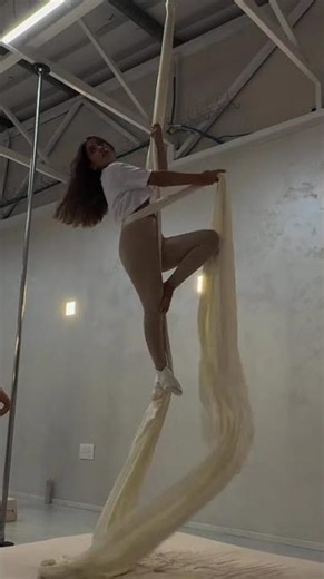 Aerialist Sets up for a Drop on Silks