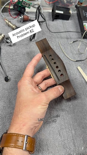 Acoustic pickup problem number two. It’s very common to get uneven volume from string to string when using an under the saddle transducer. This can be from improper installation, a saddle that is not flat on the bottom, or a saddle slot that is not flat. #legacymusic #guitar #dunnnc #northcarolinamusic #guitarist #acoustic #acousticguitars | Legacy Music