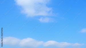 The dynamic skies of a 4K time lapse, where clouds evolve and float in a brilliant blue sky, showcasing the beauty of weather in motion. Meteorology concept. Video clips. Timelapse. Sky background. Stock Video