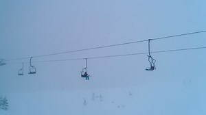 Chairlifts on a mountain covered with snow - Free Stock Video