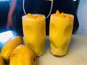 RECIPE IN ENGLISH: #milkshake #mango #milk Indulge in the creamy, dreamy delight of our Mango Milkshake 🍌🥛, a tropical treat that will transport you to a paradise of flavor! 🌴 Made with fresh mango puree 🍊, cold milk ❄️, and a hint of ice ❄️, this milkshake is a refreshing escape from the ordinary. 🌊 Imagine the sweetness of ripe mangoes 🍊, blended with the creaminess of milk 🥛, and a touch of frosty magic ❄️. It's a taste sensation that will leave you wanting more! 😋 Our Mango Milkshake