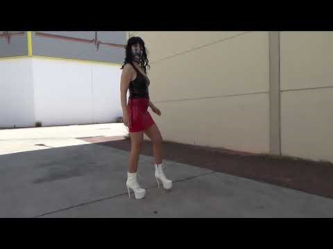 Spring Outfit. Red latex mini skirt, black vinyl top and white high-heeled ankle boots ....