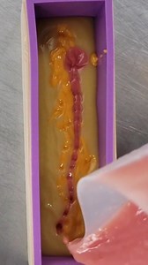 The drop swirl soap is a perfect technique for beginner soap makers. In this video tutorial, you'll learn how to layer soap in a mold and then introduce different colors, creating a swirl effect. This can be achieved by dropping the new color from varied heights, allowing the new color to sink slightly into the layer below. Check out the whole video on our YouTube Channel! https://youtu.be/TH7JooVHzbA | The Handcrafted Soap and Cosmetic Guild