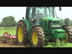 John Deere 6230 avec chisel au travail des terres
