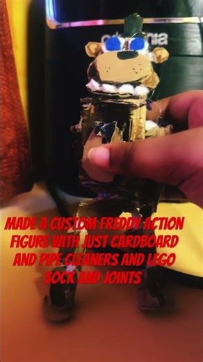 Made a custom Freddy action figure with just cardboard and pipe cleaners and Lego sock and joints