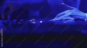 4k Close up of DJ desk pult. DJ are playing during disco party laser light show music festival. DJ hands on mixer controlling. Shooted on Red Epic Dragon camera. Slow motion DJ footage. Cinematic View