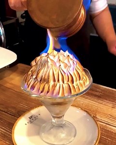 10K views · 55 reactions | Bombe Alaska with layers of raspberry white chocolate ice cream and butter cookies, enrobed in meringue, and flambéed with rum. | Ladyironchef | Facebook