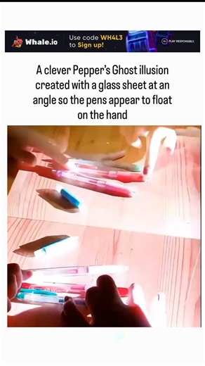 global trending hubb on Instagram: "- The post features a short video demonstrating a DIY Pepper’s Ghost illusion, where colored pens appear to float ethereally above a hand on a wooden table, achieved by reflecting hidden pens off an angled glass sheet for a seamless optical blend. - Originating in 1862 from inventor Henry Dircks and popularized by John Henry Pepper in Victorian theater, this technique uses partial light reflection to create “ghostly” superimpositions, now adapted for simple ho