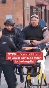A New York City police officer was shot Tuesday morning in Manhattan. Video from the scene appeared to show the officer with a gunshot wound to his upper arm. He is expected to survive his injuries, and he was seen talking and smiling as he was loaded into the ambulance. | CBS New York