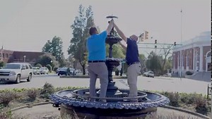 The iconic boy-and-girl statue in the Morgan Circle Fountain downtown Aiken has returned and is again perched in the middle of Laurens Street and Park Avenue intersection. A notable and old landmark that was recently disassembled, returned home Thursday from a makeover in Columbia, SC and the fountain itself underwent maintenance servicing while the statue was away. Morgan Circle Fountain was built in honor of Thomas Redman Morgan, the City’s Mayor from 1899 to 1900. During his tenure, Morgan wa