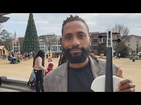 Violin music at Christkindl Market. Joseph E. Reed, The One Man Orchestra is live! 12-24-25