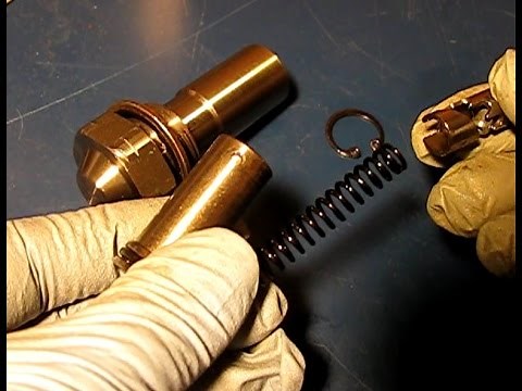 GM Ecotec timing tensioners: old and new tensioners dis-assembled, de-activated and re-assembled