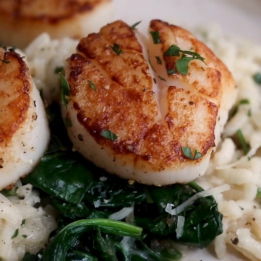 https://www.skinnytaste.com/seared-scallops-over-wilted-spinach-and/ These seared sea Scallops Over Wilted Spinach and Parmesan Risotto is easy enough for weeknight cooking or perfect for a special occasion. | Skinnytaste