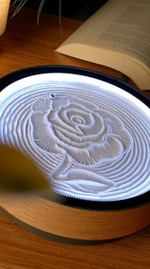 Timeless beauty in flowing sand. The Oasis Mini sculpts an elegant rose, its delicate petals and graceful stem emerging through shifting grains, bringing the romance and beauty of nature’s most beloved flower to your desktop with mesmerizing motion. | Grounded Labs