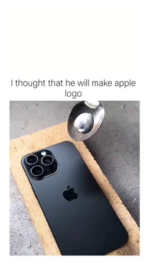 Trending reel on Instagram: "The post features a 25-second viral DIY video showing molten aluminum poured onto an iPhone 13 Pro's back to encase the Apple logo in a metal disc, which is then stamped with "YOUTUBE" and turned into a necklace pendant mimicking the platform's Play Button award. The caption "I thought that he will make apple logo" captures the poster's surprise at the defacement twist, contrasting her expectation of a restorative craft with the ironic brand swap, fueling 250 replies