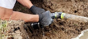 How to Cut a Drainage Channel in a Concrete Patio | DoItYourself.com