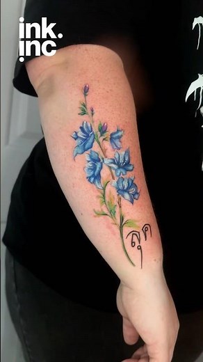 Blue Flower Forearm Tattoo Design with Thai Script. #tattoo #flowertattoo