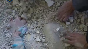 Moment rescuers spot girl buried under rubble