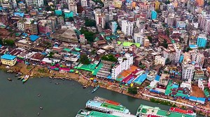 Premium stock video - Dhaka city slums running along the buriganga river, bangladesh