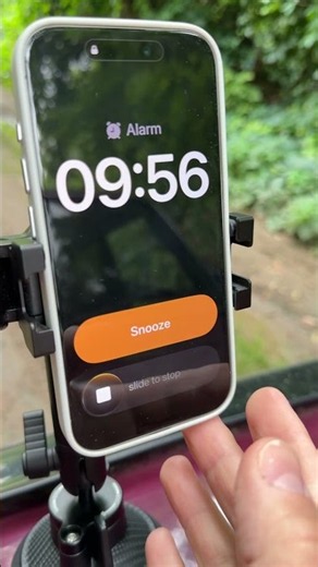 iPhone 15 Pro Alarm Clock Alert Secured on Hood of the Car with a Suction Cup