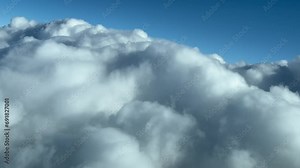 Clouds scene shot in a real time flight as seen by the pilots while flying across a sky full of stormy clouds. 10000m high.