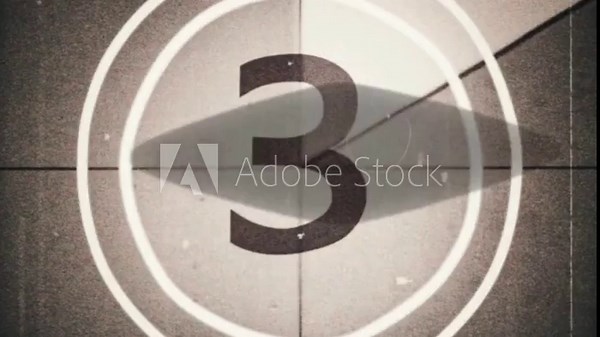 Vintage sepia-toned movie film countdown leader screen on a heavily textured grainy background.