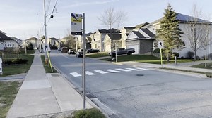 Halifax Transit bus stop information sign post with handicap access and stop number for tracking. HALIFAX, NOVA SCOTIA, CANADA - APRIL 2023