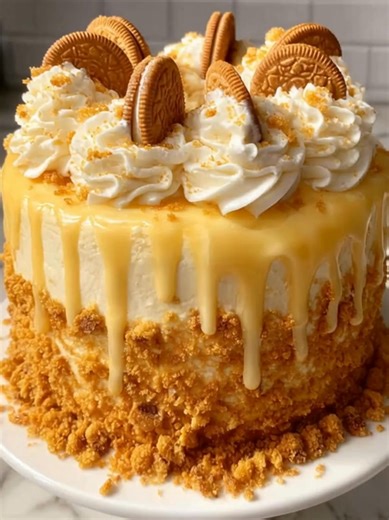 8.6K views · 284 reactions | Golden Oreo Drizzle Cake A tall, decadent cake layered with cream, topped with whipped swirls, Golden Oreos, and a rich yellow drizzle. Yield: 12 slices | Temp: 350°F (175°C) | Time: 1 hour + cooling Key Ingredients First: Golden Oreos All-purpose flour Sugar Eggs ................................. Full Recipe in First Cօʍʍеոτ  | Healthycutmeals by Claire | Facebook