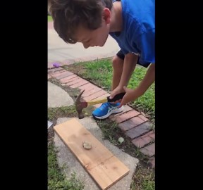 Child Cracks Geodes with a Hammer