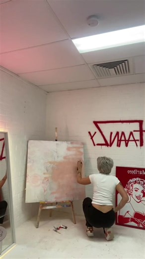 Creating Art: A Portrait in a Neon-Infused Studio