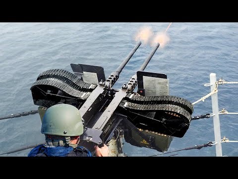 Loading And Firing US Double Barrel Machine Gun During Crazy Exercise at Sea