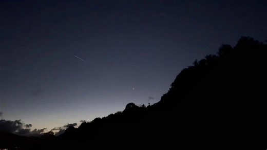 Shooting star flashes across night sky in Scotland