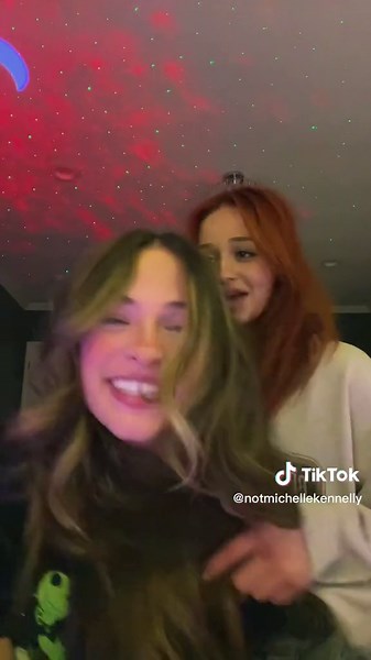 Playful Moments: Two Friends Enjoying a Fun Video