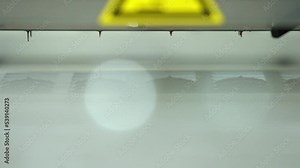 Manufacturing Of automatic production of chocolate. Melted chocolate flows down. Sweets modern factory. Food industry, automated technology equipment and engineering concept. High quality 4k footage.