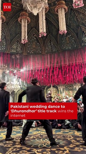 A choreographed Pakistani wedding dance set to the ‘Dhurandhar’ title track has gone viral, reflecting the film’s growing cross-border appeal. The Instagram clip shows a lead performer and a coordinated group dressed in black delivering an energetic routine that impressed viewers on #socialmedia. 🎥: @abdullahrafiquee #Dhurandhar #ViralVideo #viral #WeddingDance #wedding | The Times of India