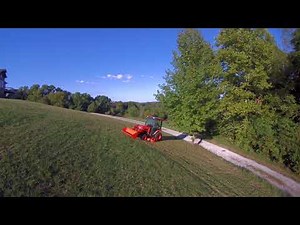 Kubota B3350 with 72" Belly Mower on a steep hill