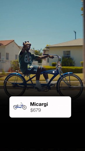 Offset with retro style bike and crazy iced out house chain showing us drip in his and Cardi B new music video