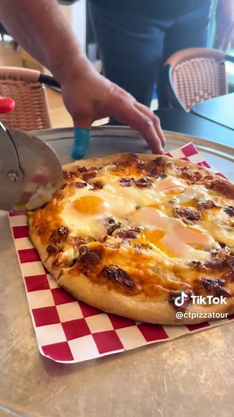 The breakfast pizza from the Salty Tomato Pizzeria in West Haven, Connecticut. We asked for the eggs sunny side up. They delivered. #pizza #ctpizzatour #asmr #foodie #breakfastideas