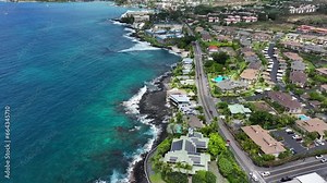 Aerial ocean coastal hotel resorts Kona Hawaii 1. Big Island. Luxury resorts, townhouses and homes on coast tropical landscape. Volcanic lava environment. Economy is tourism based. Beach.