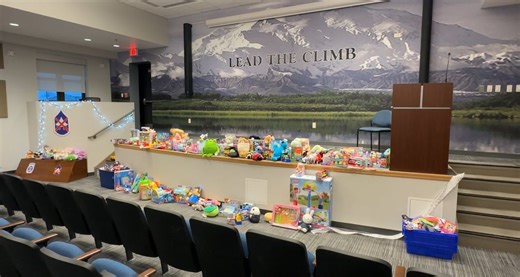 Fort Drum soldiers march through snow to deliver Mountain of Toys