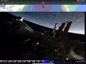 International space station, live, video, capture ￼ in this video clip, you can see objects being reflected on the main body of the International space Station. It comes in from the left-hand side goes towards the middle and then splits into two going in opposite directions. This was just before blue screen. Enjoy | SkyWitness.Space