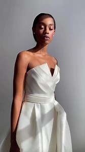 60 reactions | Meet the Allison Webb New York #ParkerGown  This contemporary trumpet gown features an architectural, pleated bodice, detachable overskirt and asymmetrical bow  Try her on and many more at this weekend's #AllisonWebb trunk show by making an appointment via  https://bit.ly/3rho84J | Kleinfeld Bridal | Facebook